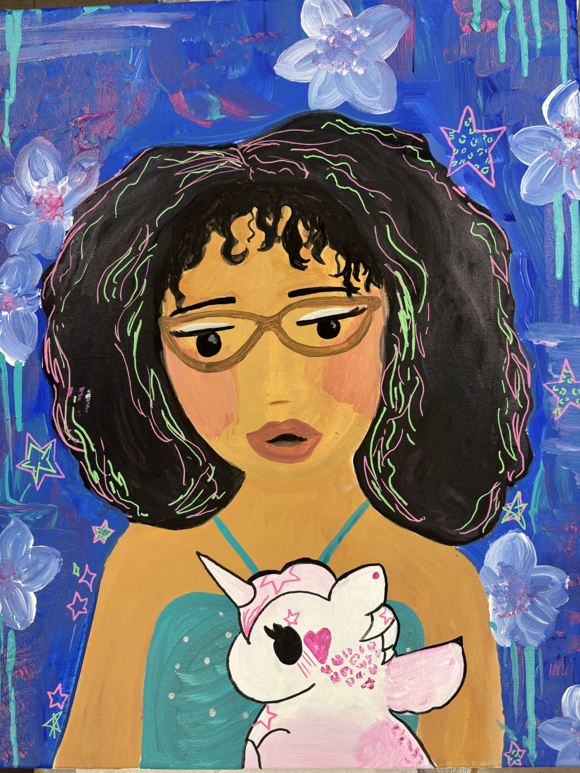 Self Portrait 
Brown skin girl with afro and glasses with royal blue backround, white flowers, and pink, purple, and teal detailing and stars. Small white unicorn in front of girl with one eye showing,wings, and pink fur and details. 